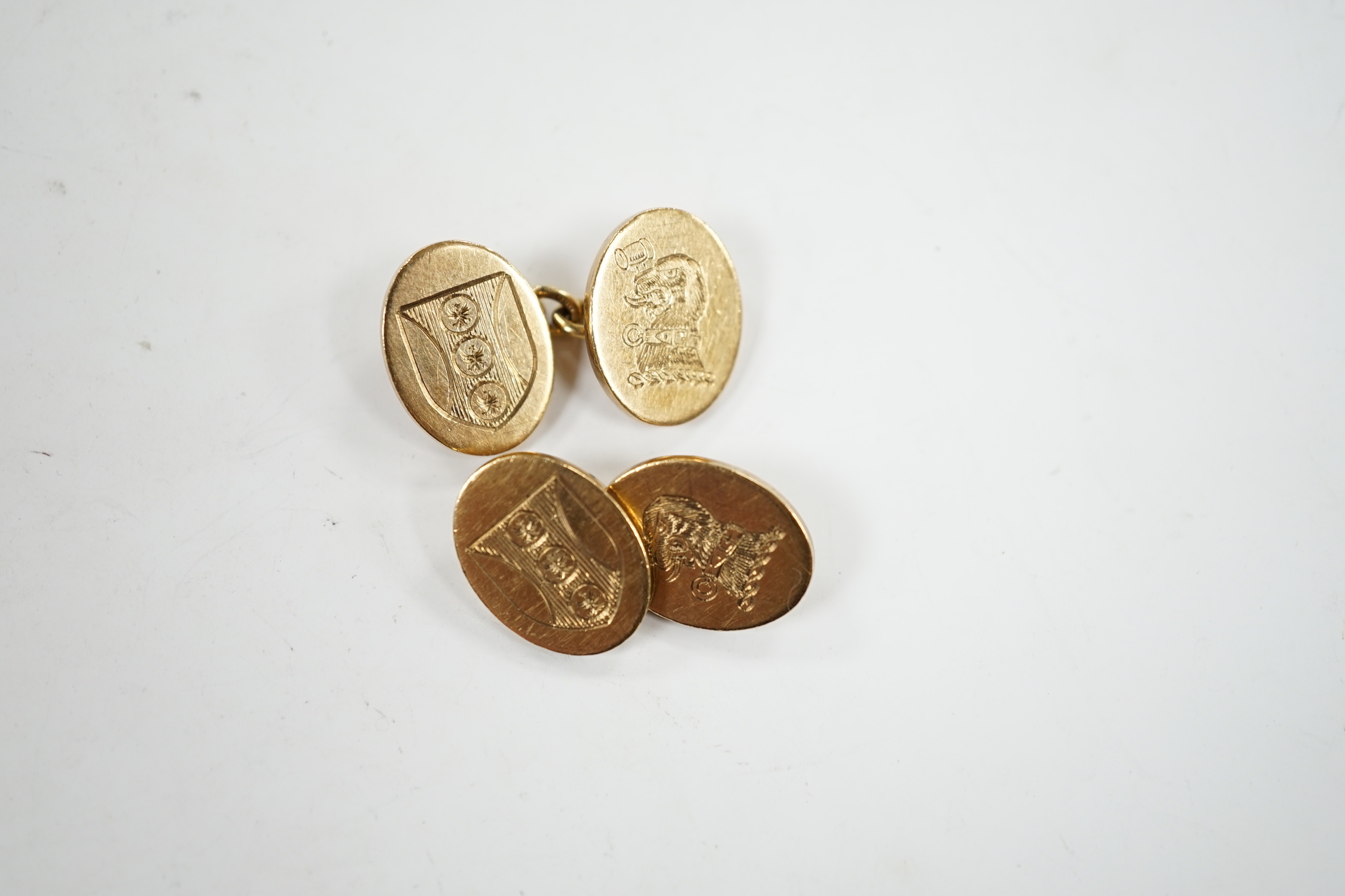 A pair of early 1960's 9ct gold oval cufflinks, with engraved crest and monogram, 10.3 grams.
